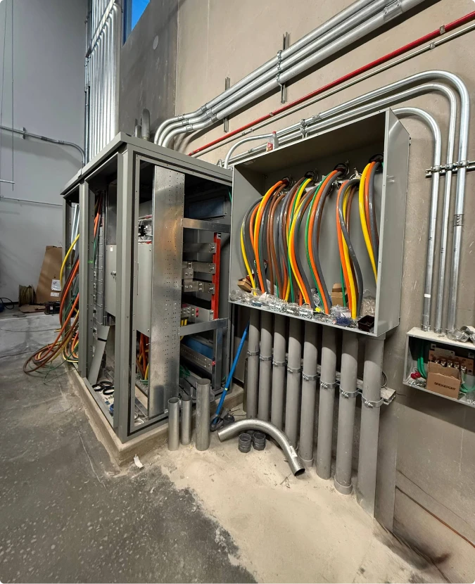 Industrial electrical panel wiring and conduit installation in Naperville by T-TECH Power.