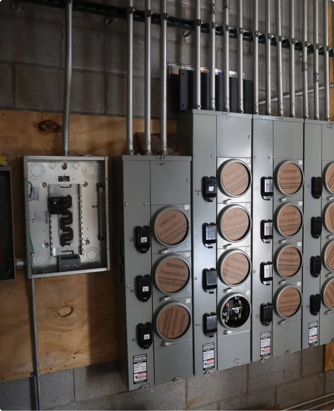 Industrial main breaker panel and meter socket installation in Elgin by T-TECH Power.