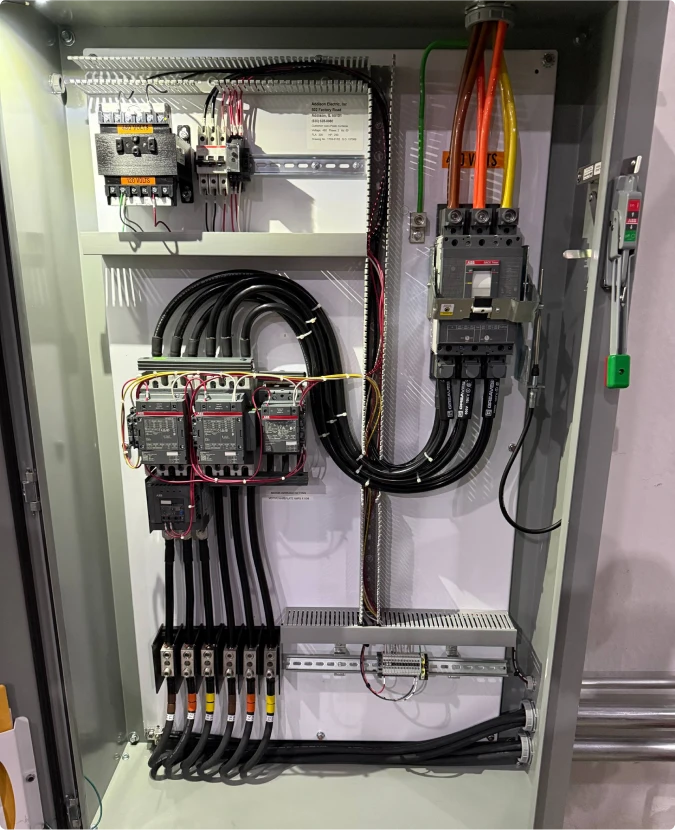 Main electrical distribution board setup for industrial facility in Joliet by T-TECH Power.