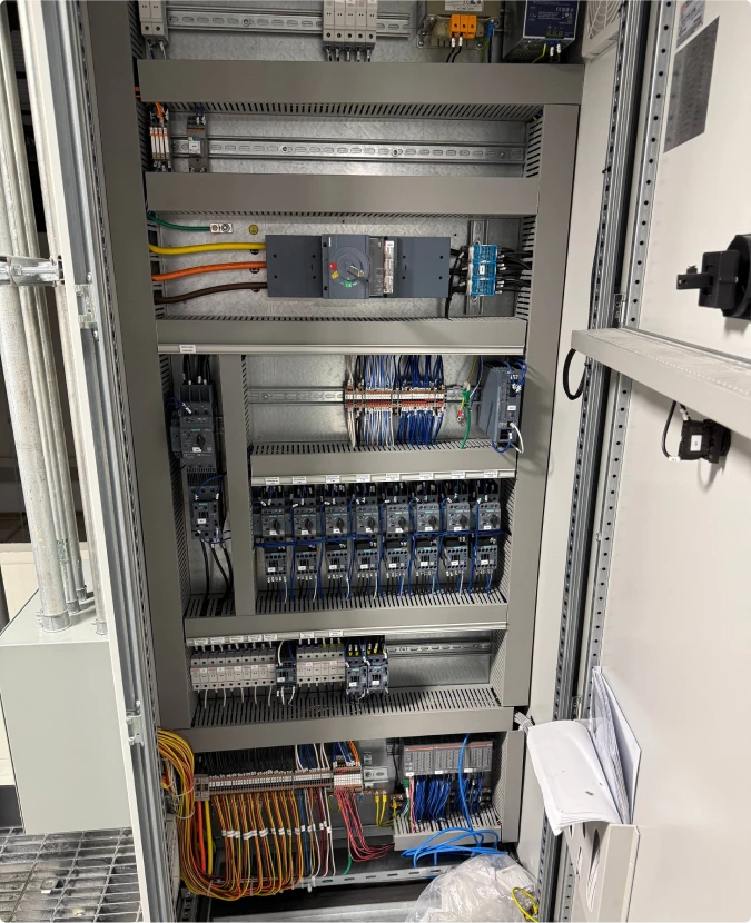 Complex motor control cabinet and industrial PLC wiring by T-TECH Power.
